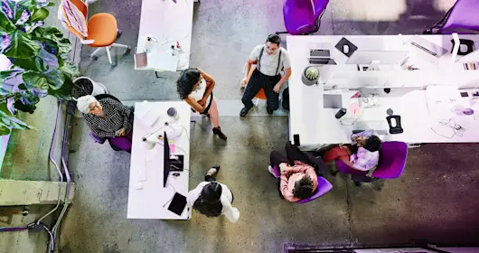 Overhead view of design team having project meeting in office