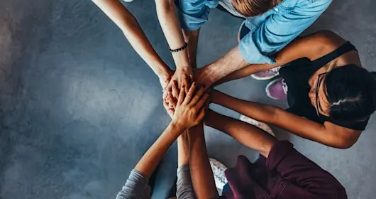 Students stacking their hands